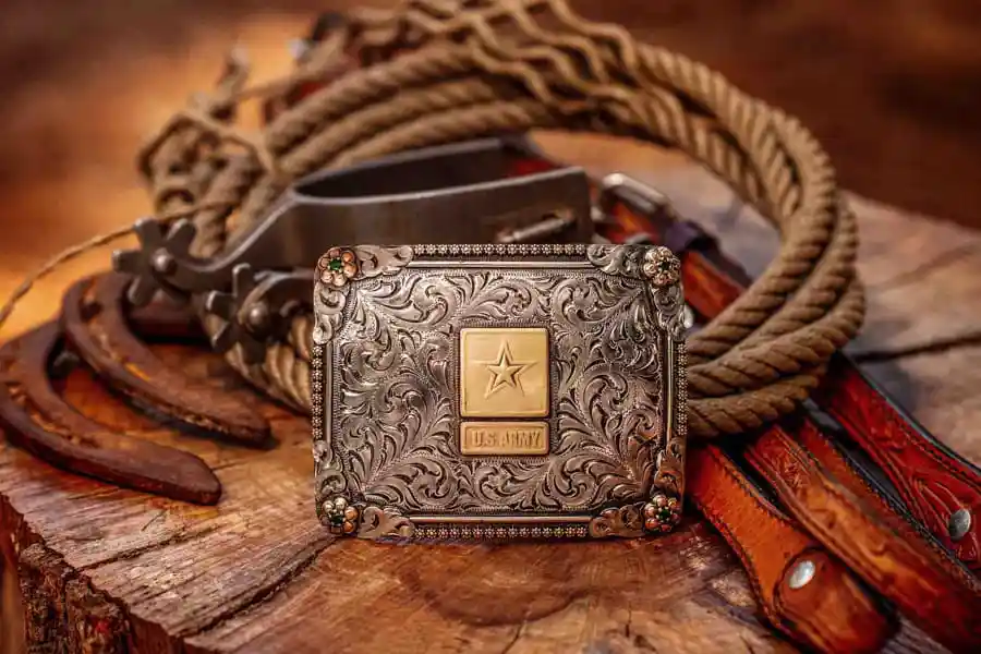 A Military Belt Buckle with the US Army emblem in a western background